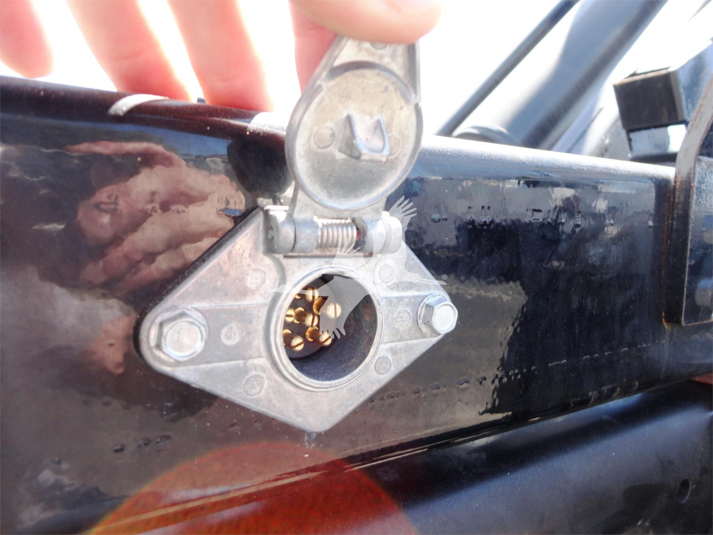 Trucks component view showing hitch mechanism with U-shaped latch and circular receiver.
