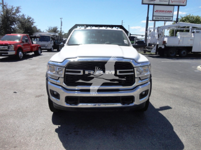 Ram 5500 front view showing chrome grille with RAM logo and large bumper, in a dealership lot.