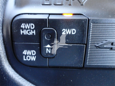 Ram 4WD off-road mode selector with 4WD HIGH, 4WD LOW, 2WD, and N neutral indicators in a vehicle dash.