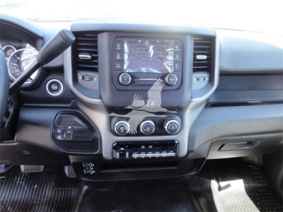 Ram 5500 HD truck interior showing center touchscreen, dual climate controls, and steering wheel with dash area.