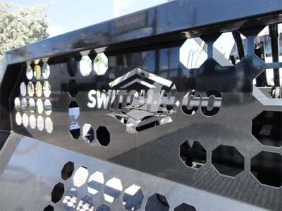 Ram 5500 truck front grill with Switch-N-Go logo and honeycomb pattern, metal components visible.