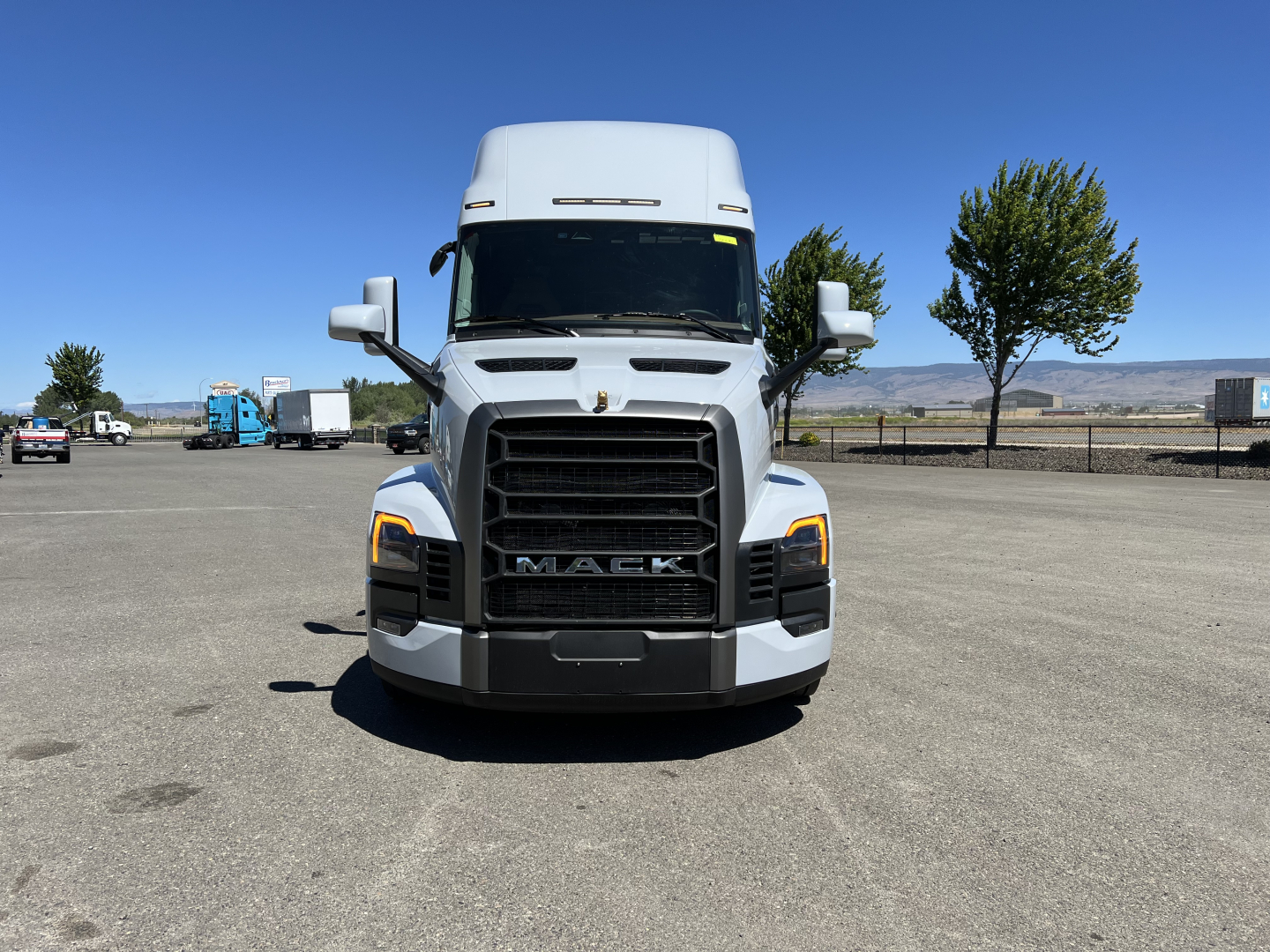 Mack PR64T76H truck front view showing grille and headlights with Mack emblem