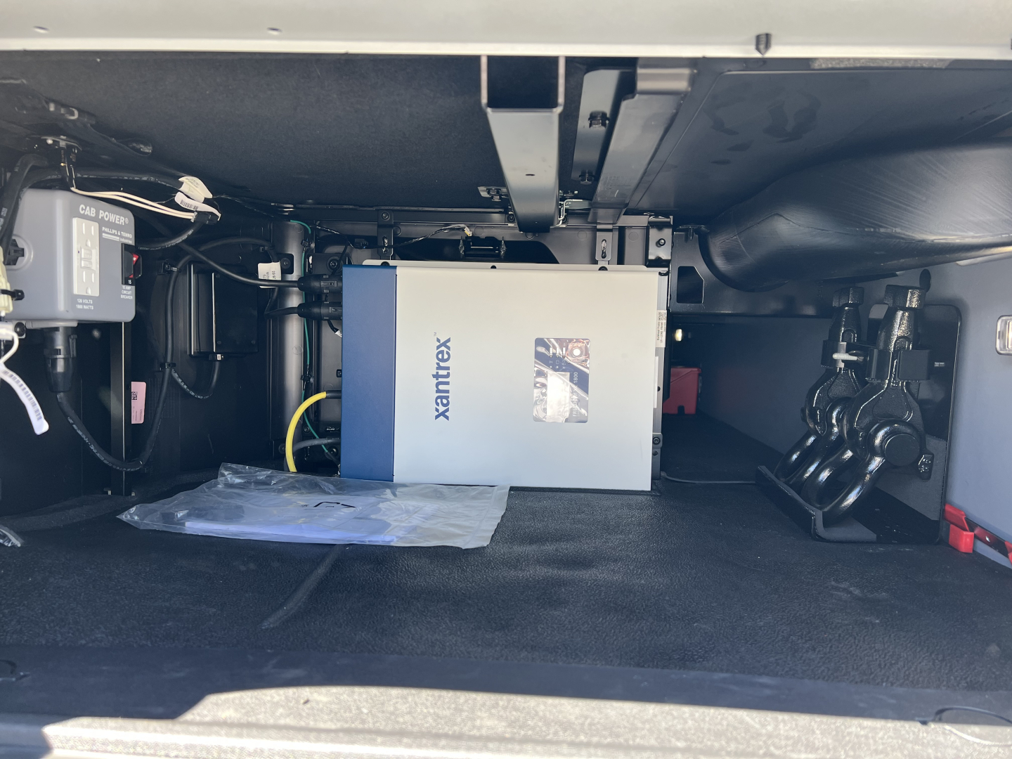 Mack PR64T76H sleeper truck engine bay showing Xantrix power module and associated components