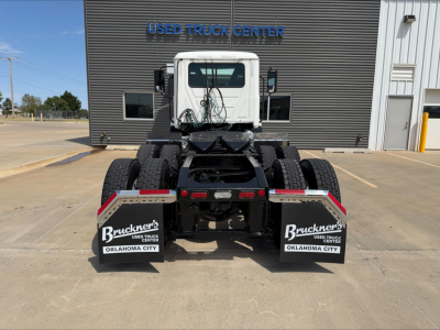 Truck rear view of a 2020 Mack Anthem used conventional daycab showing dual rear tires, mud flaps with Bruckner’s Oklahoma City branding, wiring, and fifth wheel/slide connections.