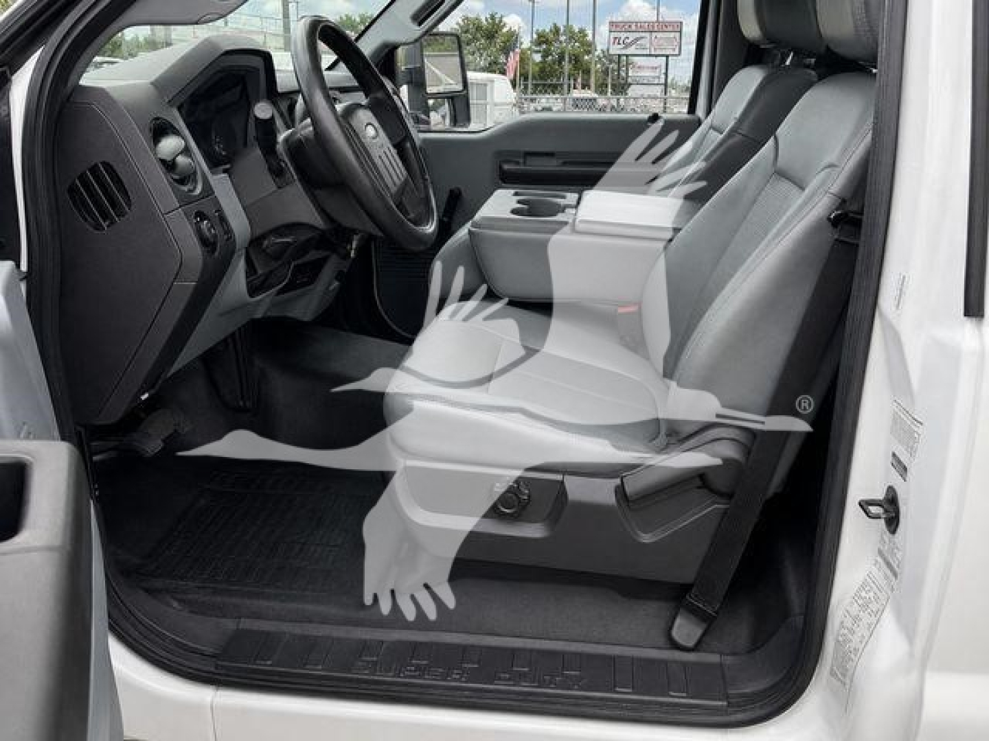 Ford F-450 interior left-hand drive showing front seat and dashboard view.