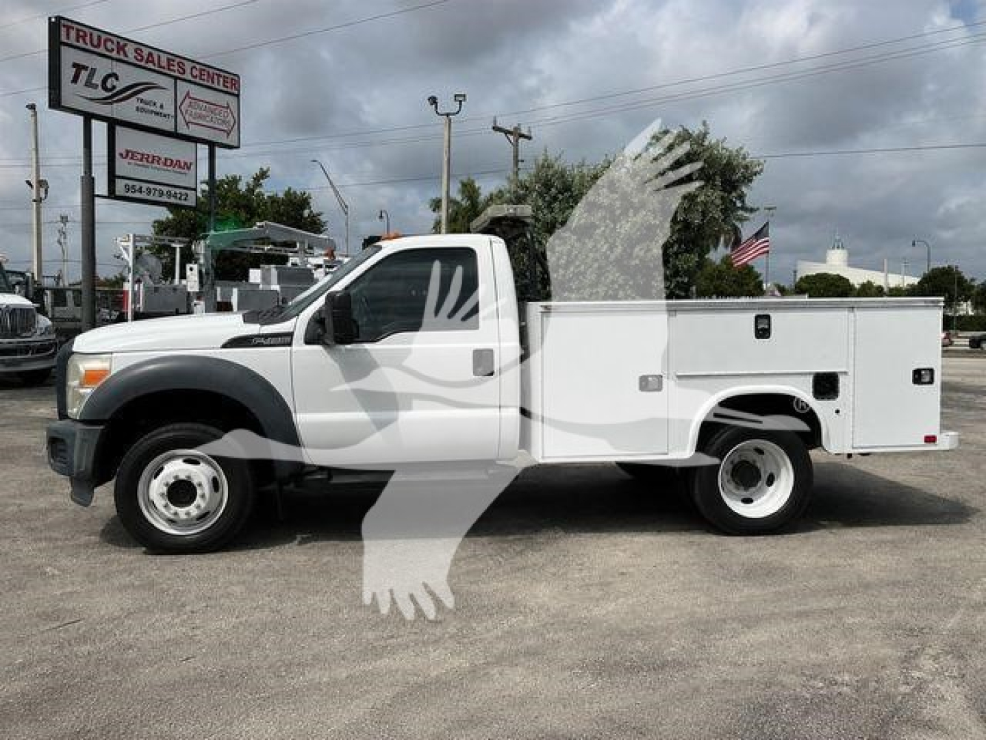 Ford F-450 service/utility truck in white, side view, with utility bed and compartments.