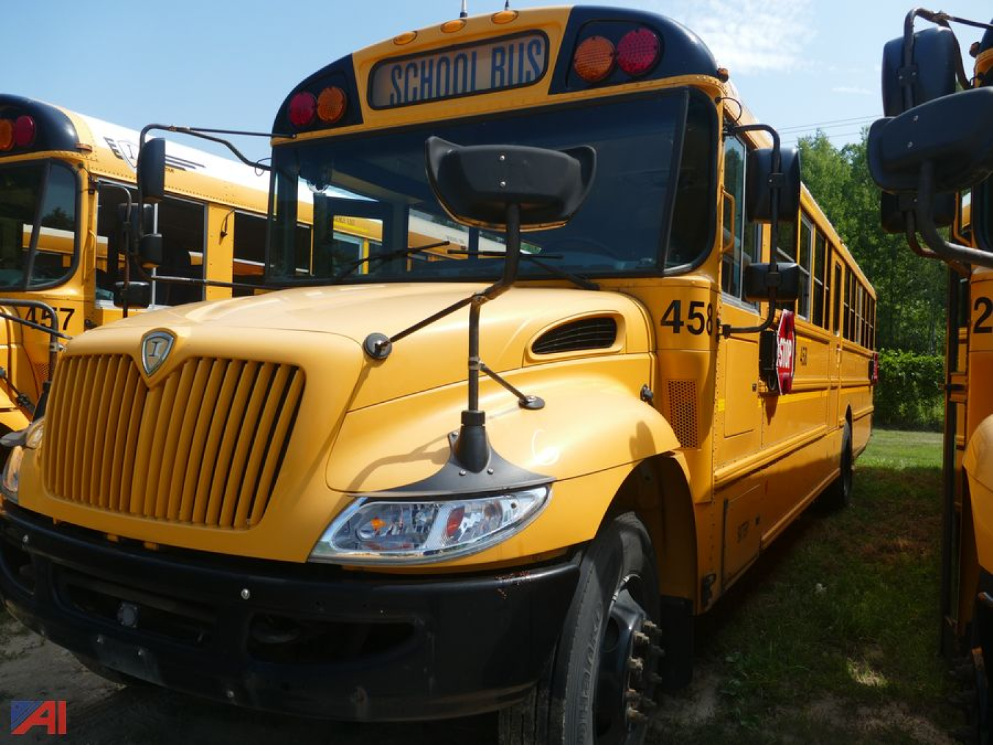 School bus with yellow body 2019 International CE 3000, front view, side number 451, 'SCHOOL BUS' sign on the roof, daytime outdoor lot.