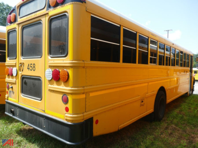 School bus rear view showing yellow body and rear bumper, tail lights, and number 458 on the back.