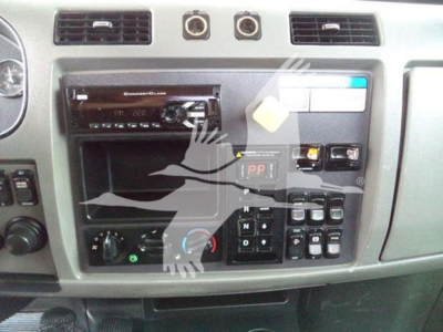 Peterbilt 337 dashboard/center console showing radio head unit and control panel with gear selector and switches.