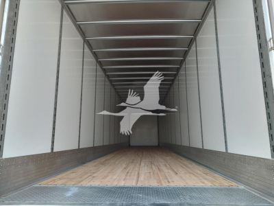 Trailer interior showing empty cargo space with wooden floor and metal sidewalls in a Vanguard Vxp trailer.