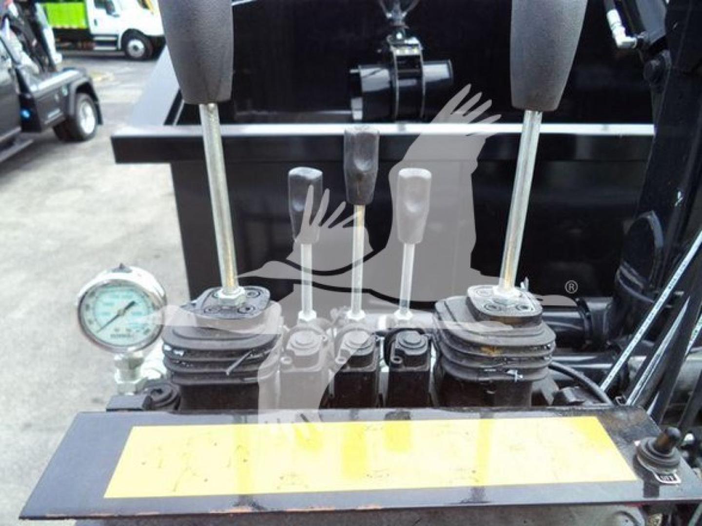 Peterbilt 337 controls and levers in cabin area with gauges visible and yellow safety plate.