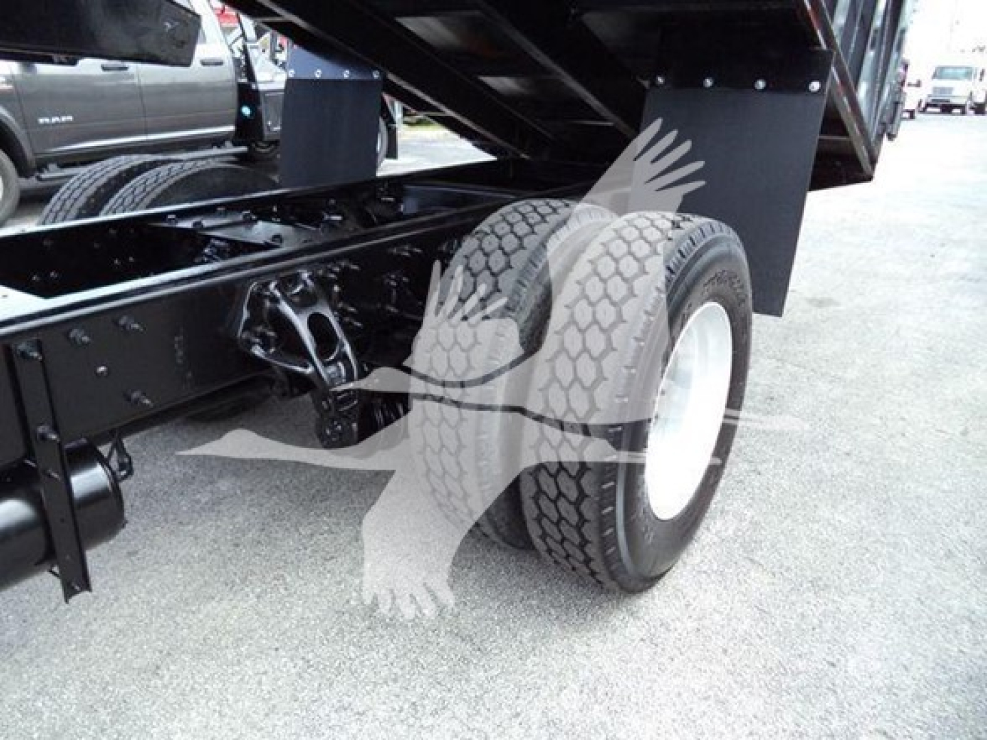 Peterbilt 337 truck rear wheel and suspension view showing dual rear tires and chassis components.