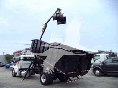 Peterbilt 337 grapple truck in side view with lifting attachment and dump bed, 2020 model year
