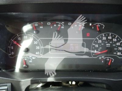 Dashboard of a 2020 International MV showing gauge clusters with speedometer, tachometer, fuel, and warning lights. The image includes a watermark overlay of hands.