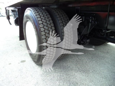Truck rear dual wheels and undercarriage portion of a 2020 International MV showing tires and suspension components.