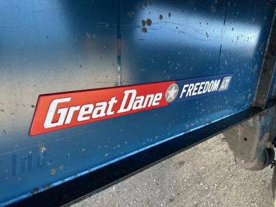 Great Dane Freedom LT trailer side with logo emblem and blue paint.