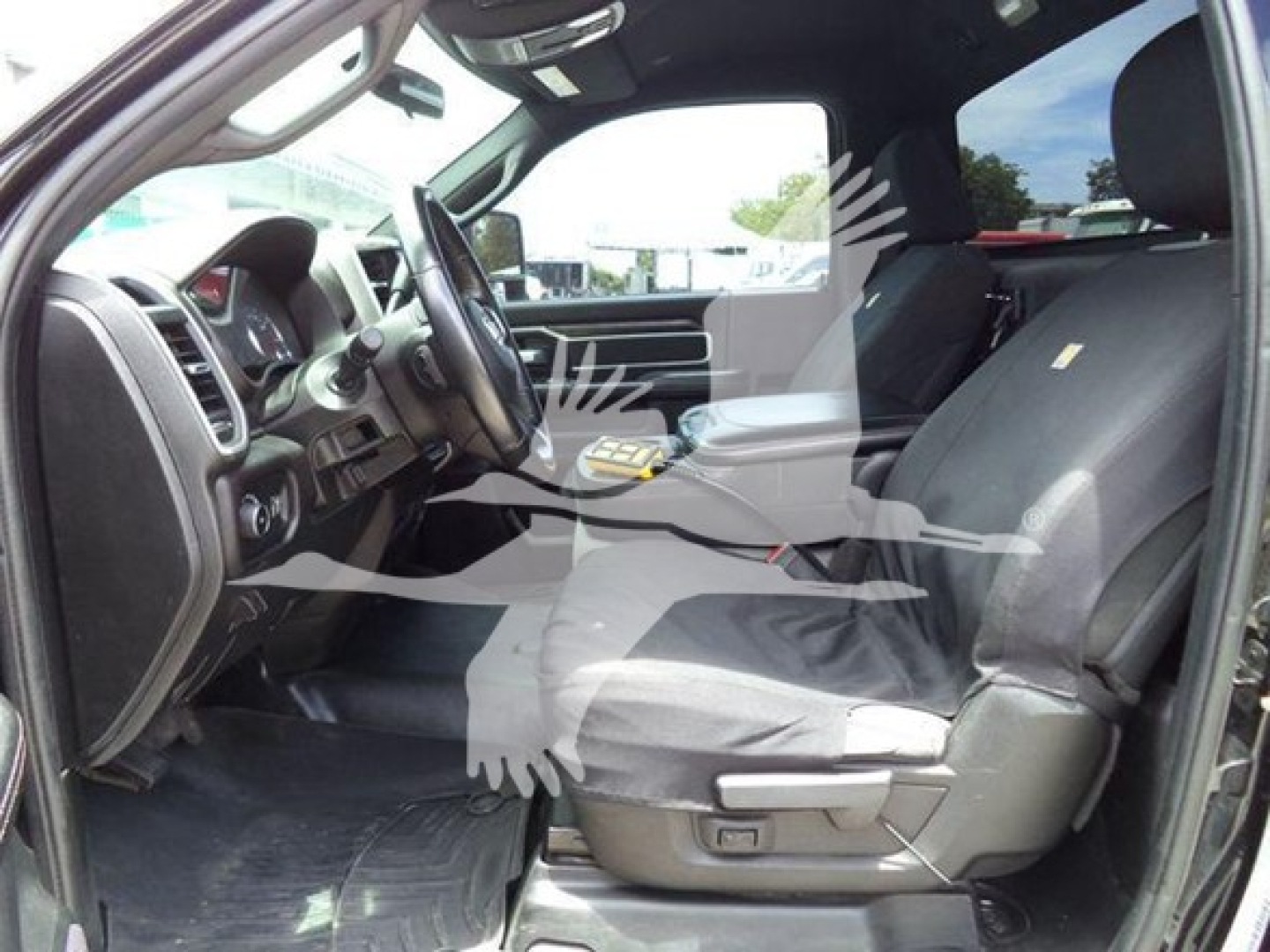 Ram 4500 SLT cab interior showing front seats and dashboard with steering wheel and center console.