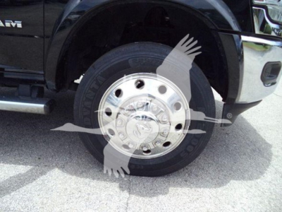 Truck front wheel and tire close-up in-service Ram 4500 SLT wheel steel rim with tire branding visible.