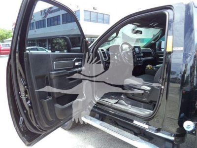 Ram 4500 SLT crew cab interior from open driver door, showing dashboard and steering wheel with open front seats.