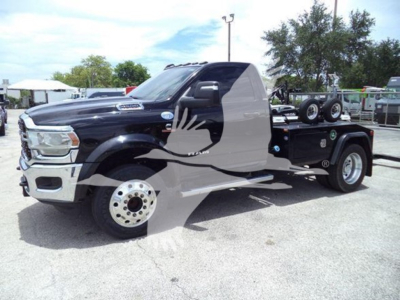 Ram 4500 truck showing cab and winch chassis with black paint and chrome front, side view.