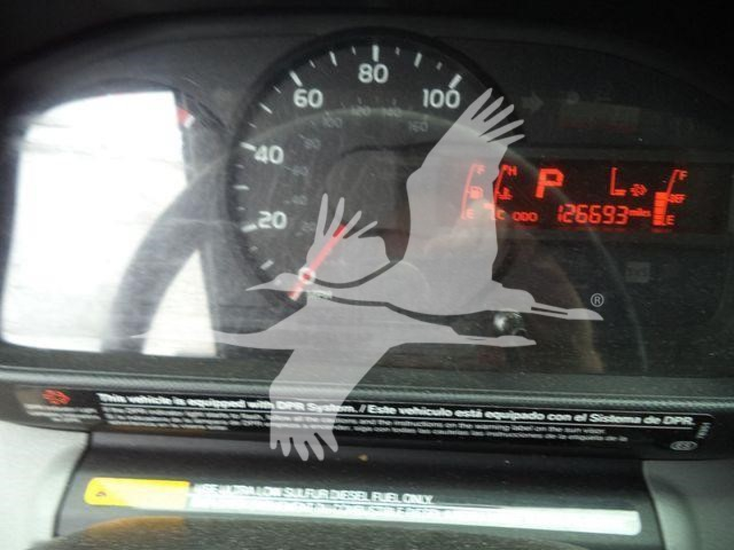 Dashboard of a 2019 Hino 195 roll-off truck showing instrument cluster and digital displays with R, L, and temperature readouts.