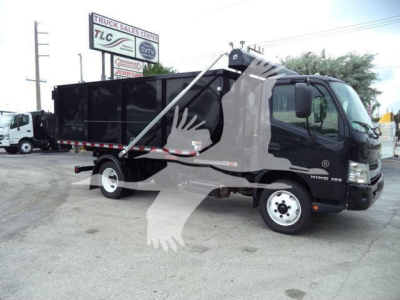 2019 Hino 195 roll-off truck in gray and black, side view, with large dump bed and hydraulic arms
