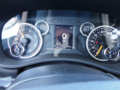 Ram 5500HD instrument cluster showing digital speed readout '0' and multiple gauges in view, with RAM logo above the center display.
