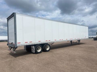 Trailer showing a white 2016 Wabash van with dual rear axles and a long box.