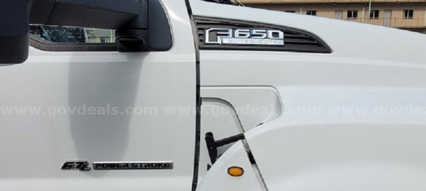Ford F-650 F650 badge on cab side and EZ Power Stroke badge with VIN and stock information not visible.