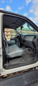 Ford F-650 cab interior showing driver seat and dashboard in a box truck.