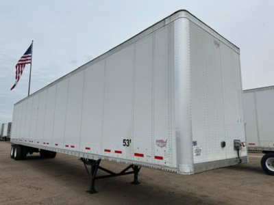 Trailer side view of a 2014 Wabash van trailer showing a 53' aluminum exterior with warning placards, rear door area, and support legs in the front. VIN visible, stock U90818.