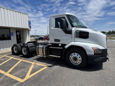 White Mack AN64T conventional daycab tractor in parking lot, side view with cab and dual rear axles, stock number 72444 visible.