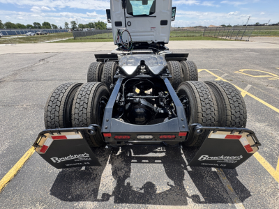 Mack AN64T conventional daycab rear view showing chassis, dual rear axles, fifth-wheel area, and mud flaps with Brandt truck branding