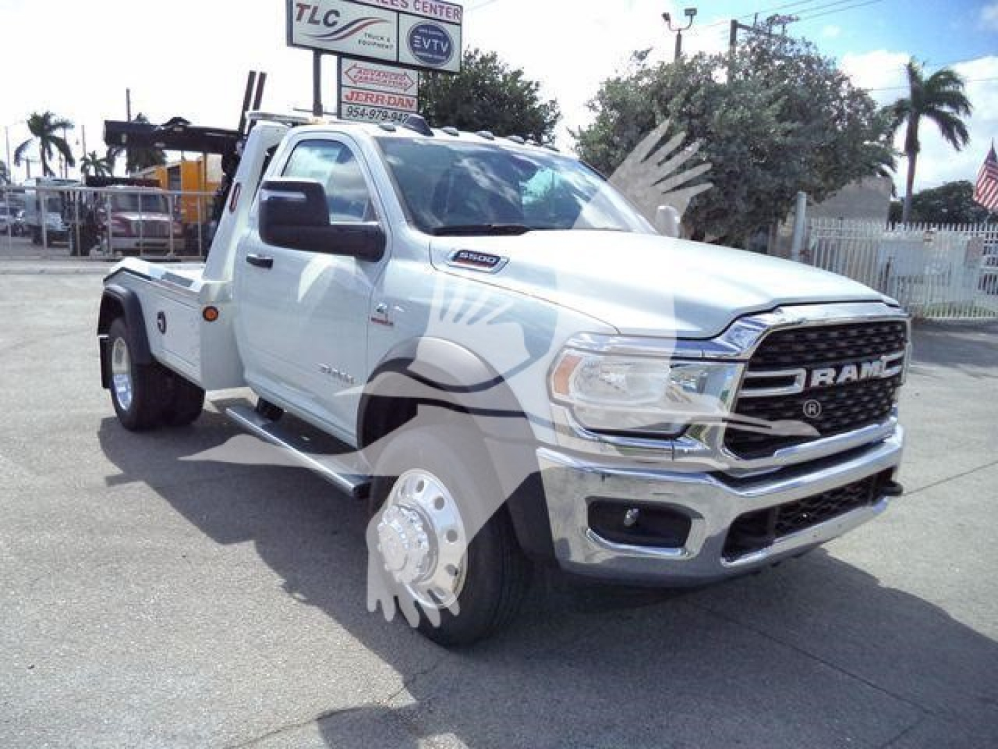 Ram 5500 SLT in white pickup with tow rig conversion and large front grille.