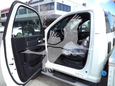 Ram 5500 SLT crew cab interior with front passenger door open showing seating and dash area.