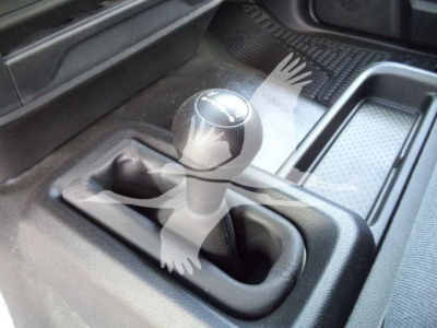 Ram 5500 SLT interior showing manual shifter in foreground with center console