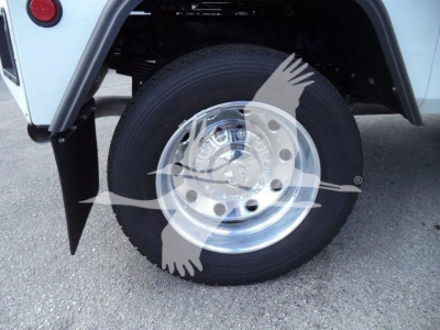 Ram 5500 wheel and tire showing chrome hub and wheel well, front right corner