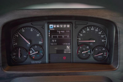 Western Star 49X instrument cluster showing digital display with trip mpg 6.6, 70°F, 1.936 miles, N gear, RPM gauge and analog gauges for speed, fuel, oil, and water.