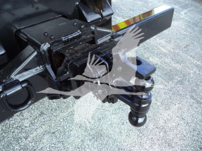 Tractor hitch and towing setup on Freightliner M2 106 in-service with ball hitch and pintle coupler visible.