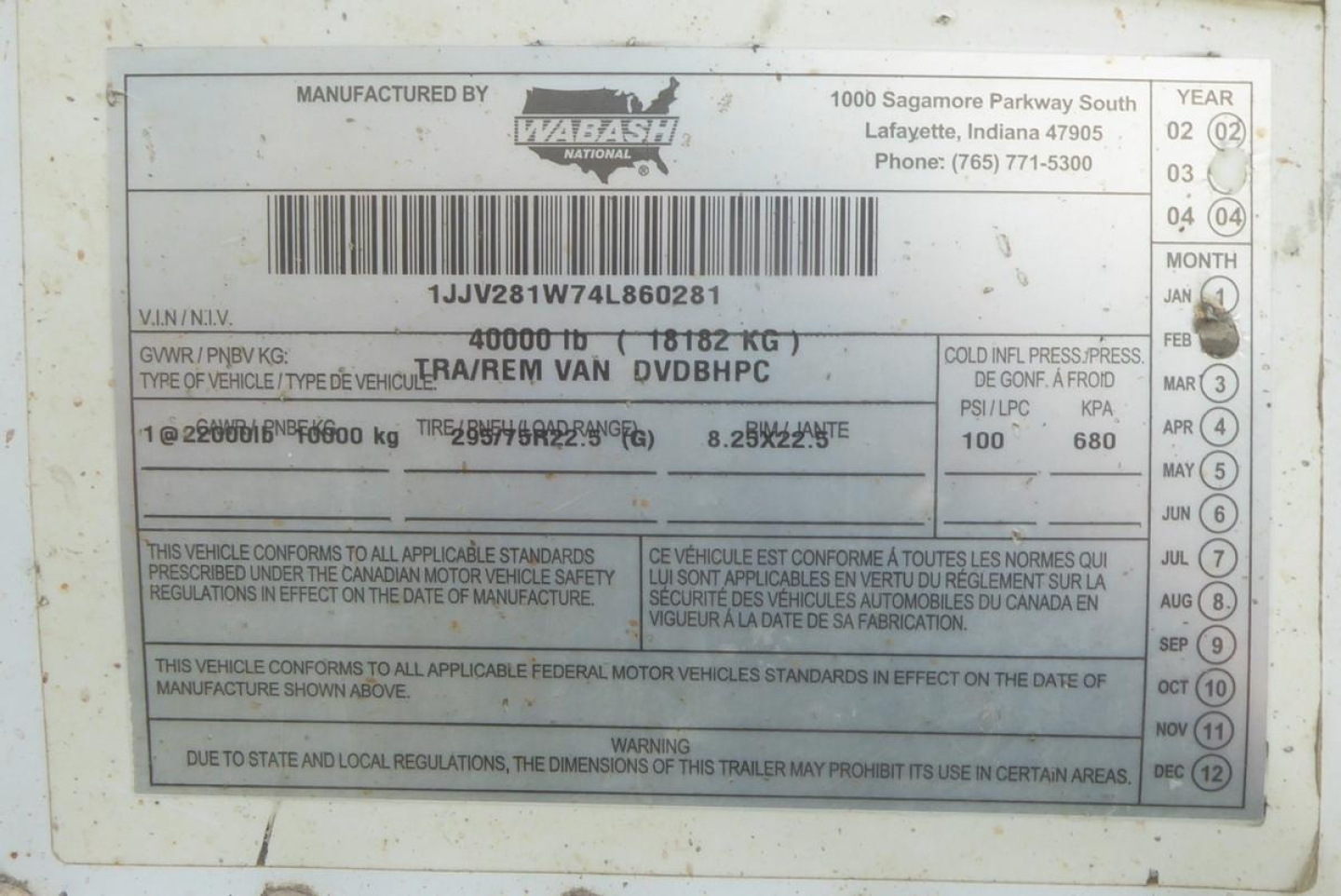 Vin plate on Wabash trailer showing VIN 1JJV281W74L860281, GVW 40000 LB (18182 KG), type of vehicle REM VAN DVDBHP, manufacturer WABASH, address and year/month labels, bar code, and regulatory statements.