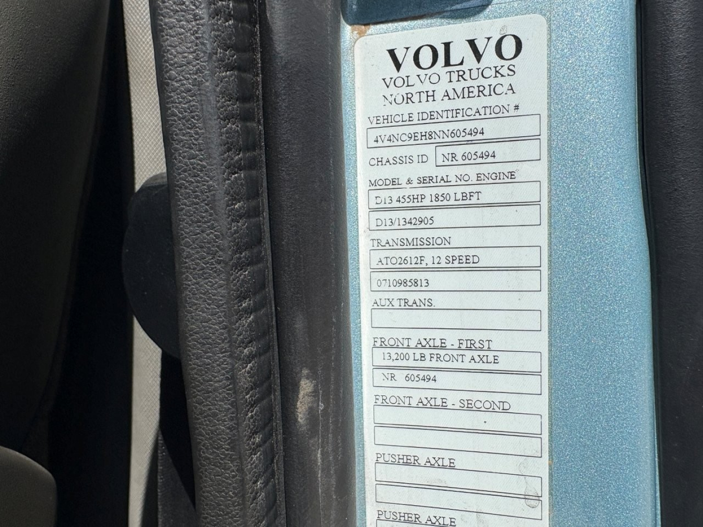 Volvo truck door sticker with VIN and model info: VEHICLE IDENTIFICATION # 4V4NC9EH8NN605494, CHASSIS ID NR. 605494, MODEL & SERIAL NO. ENGINE D13 455HP 1850 LBFT, TRANSMISSION AT20612F 12 SPEED, FRONT AXLE FIRST 13,200 LB FRONT AXLE, FRONT