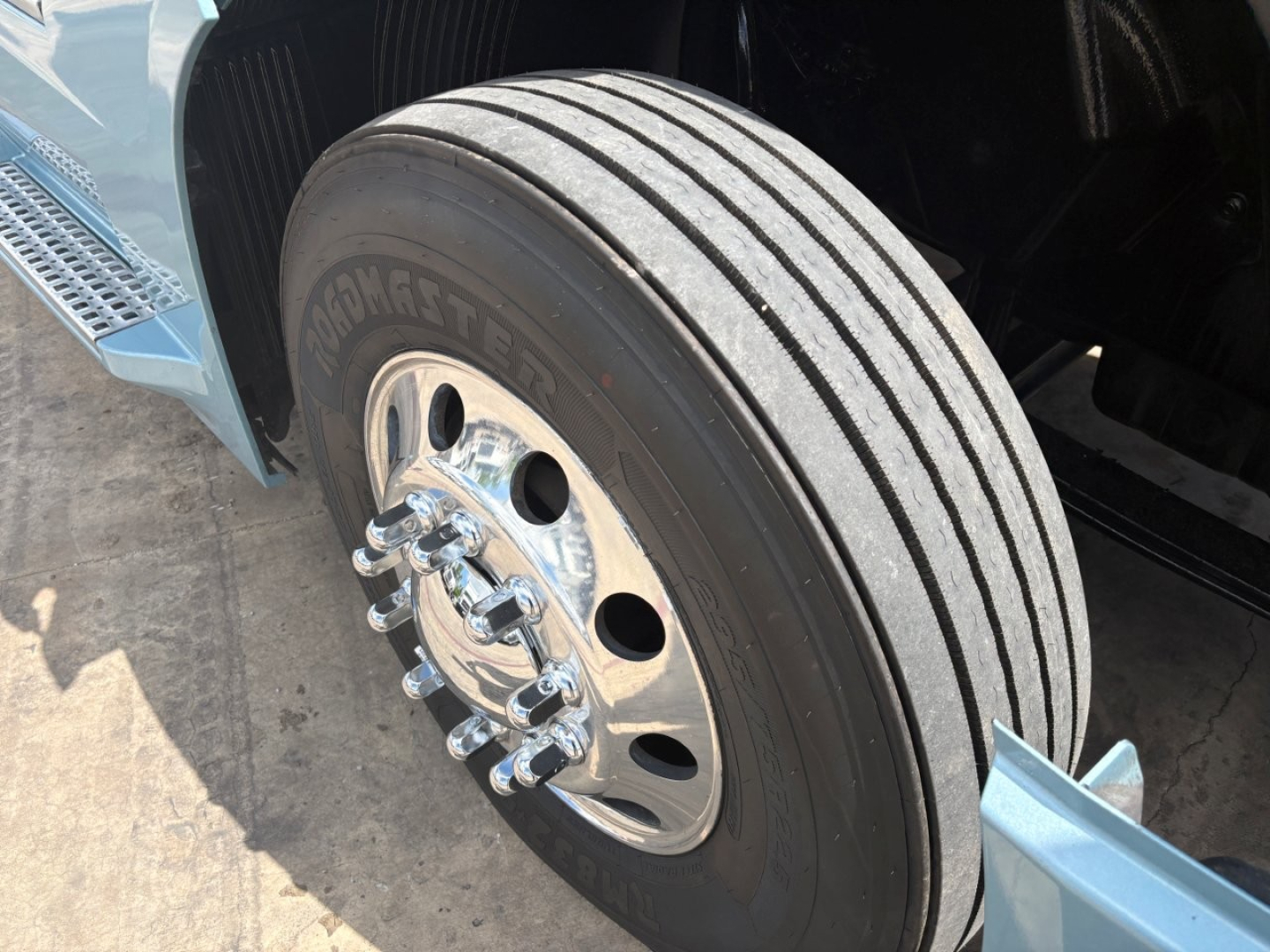 Volvo VNL64T760 truck wheel and tire view showing Goodyear tires and chrome lug nuts.