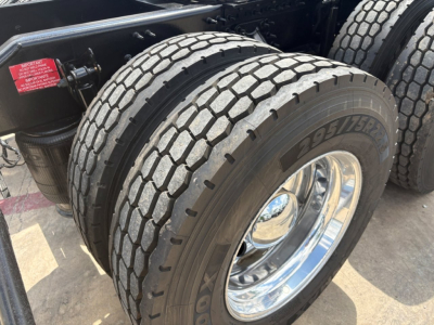 Volvo VNL64T760 truck dual rear tires showing tread and chrome wheel with Goodyear tire brand.