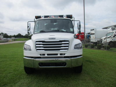 Front view of a white 2027 Freightliner M2 106 dump truck showing grille, headlights, and chrome bumper.