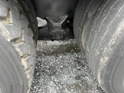 Rear view showing drivetrain crossmember and dual rear tires on a used 2019 Capacity TJ6500 truck.