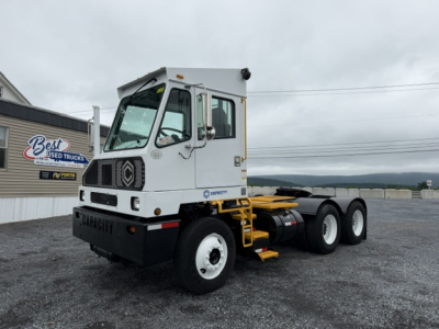 Truck chassis with cab showing TJ6500 Capacity, 3-axle, white cab, black bumper, yellow steps, Pierre crane? visible side decal. 2019 model, VIN 4LMDF7136KL028421.