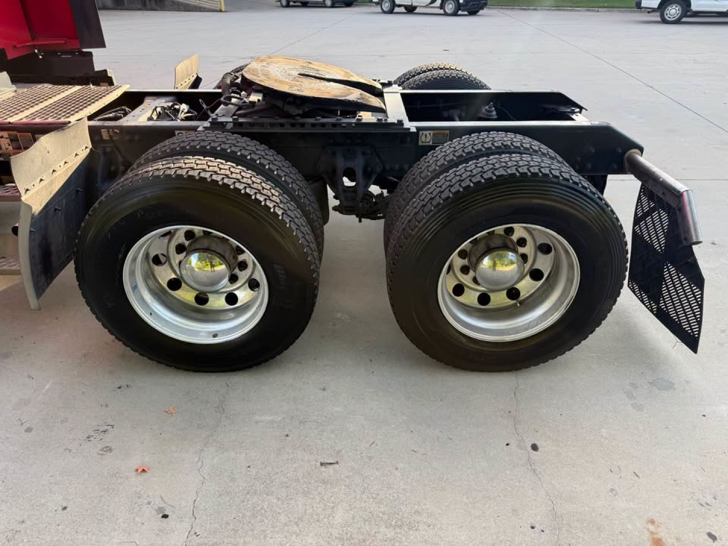 Kenworth T680 chassis rear dual rear wheels showing wheel rims and suspension mounting.