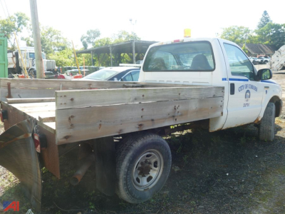 Ford F-350 Super Duty flatbed truck in a used condition, single rear wheel, white cab with blue stripe, wooden flatbed, City of Glendale markings on door