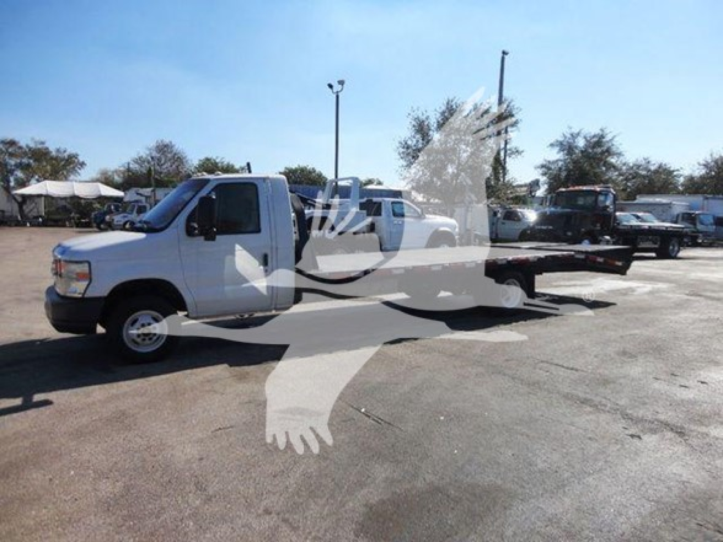 Ford E450 flatbed truck in-service showing side view with extended cab and flatbed, VIN 1FDXE4FS9BDA06273, stock T06273.