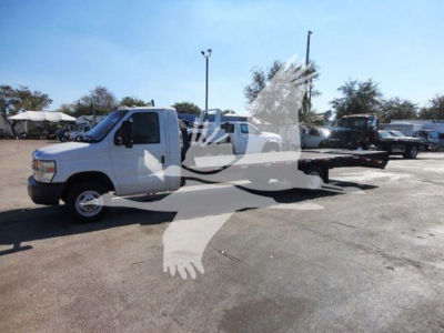 Ford E450 flatbed truck in-service showing side view with extended cab and flatbed, VIN 1FDXE4FS9BDA06273, stock T06273.